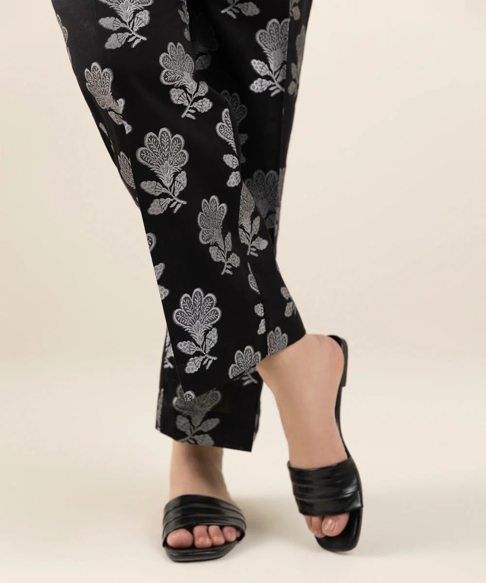 Stylish black jacquard pants by Sapphire, highlighting a sleek silhouette – a versatile choice for Punjabi suits in Canada.