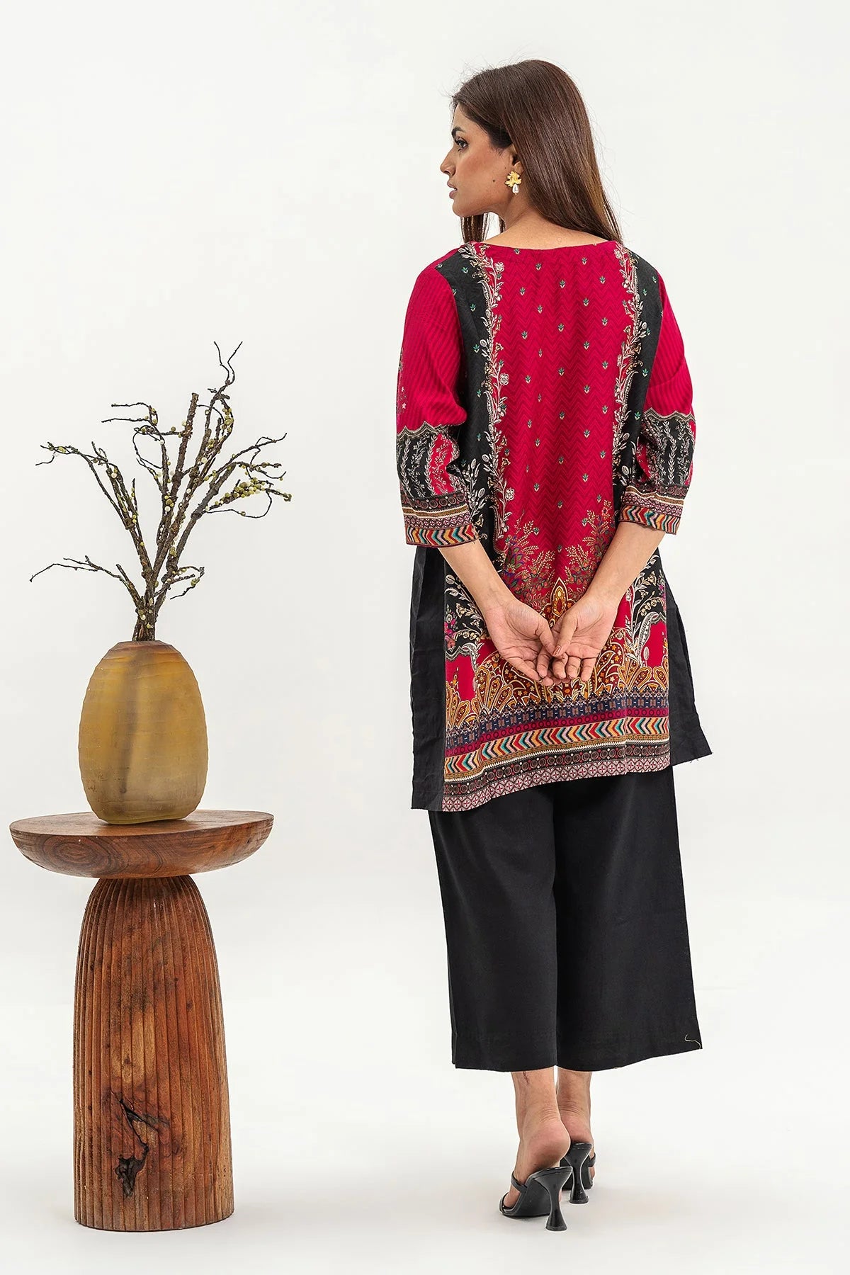 Rear view of Charizma’s red linen shirt, featuring a smooth linen finish – a premium addition to Punjabi suits.