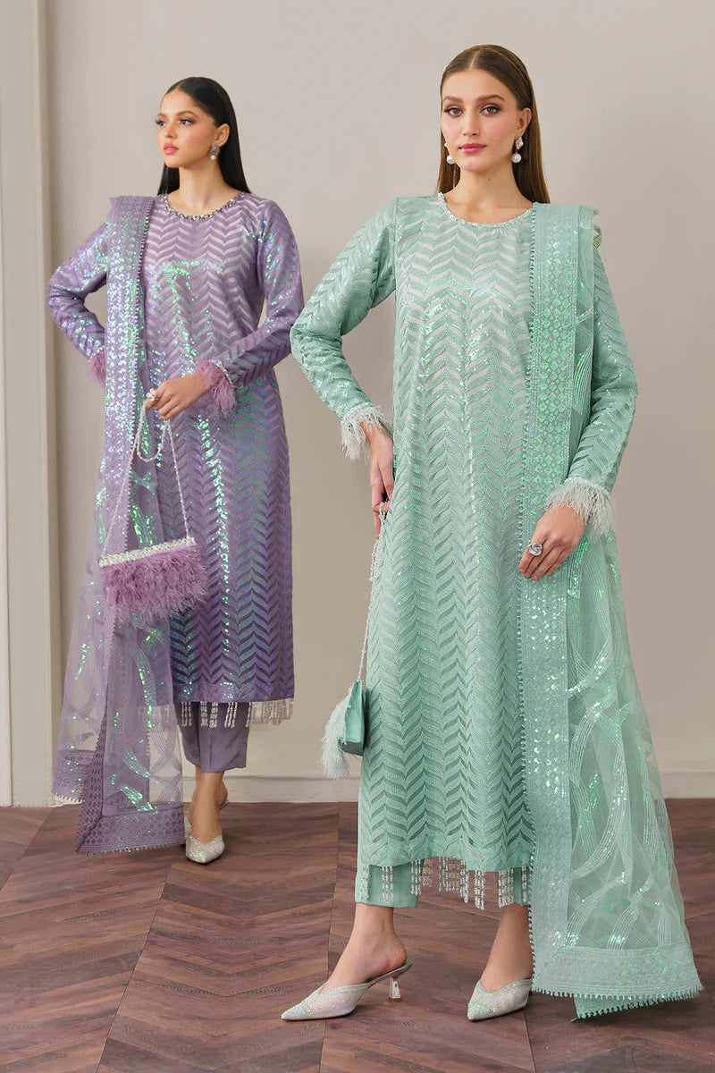 TWO WOMEN SHOWING Baroque’s embroidered net fabric, showcasing intricate detailing and fine craftsmanship in this Pakistani suit.