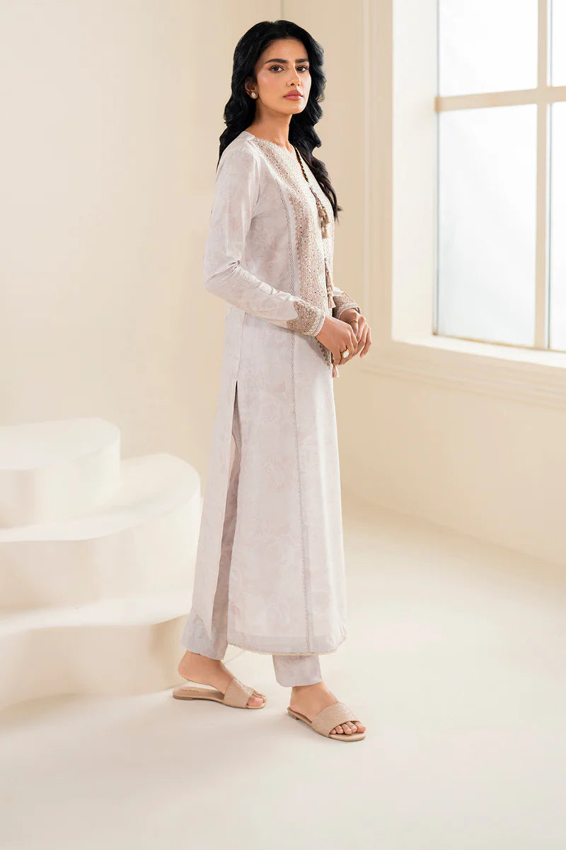 Side profile of Jazmin’s off-white embroidered lawn suit, showcasing intricate digital embroidery – a must-have for Pakistani suits Canada.