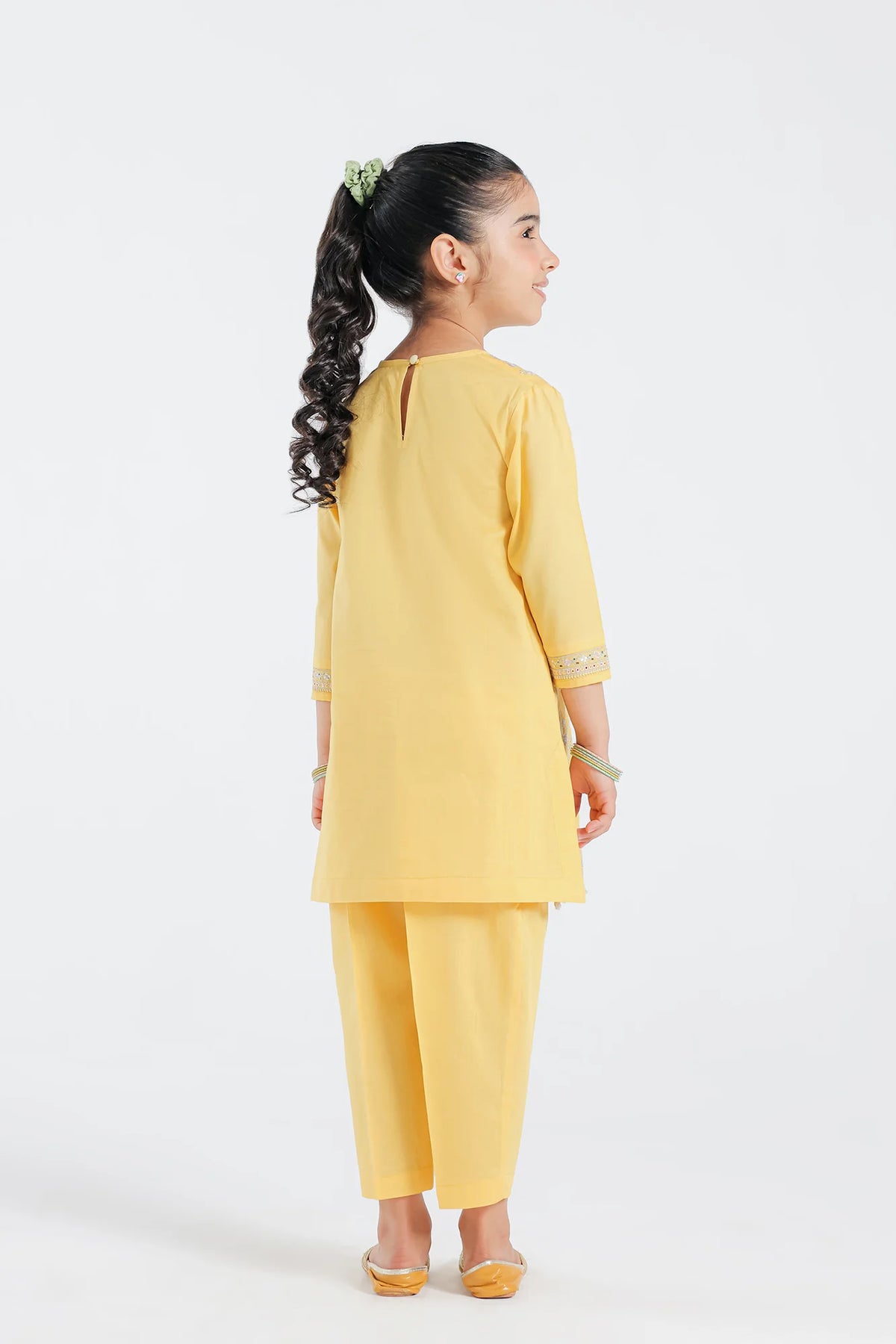 Pakistani suits for kids – Ethnic's yellow embroidered kurta and trouser set with delicate Schiffli details.