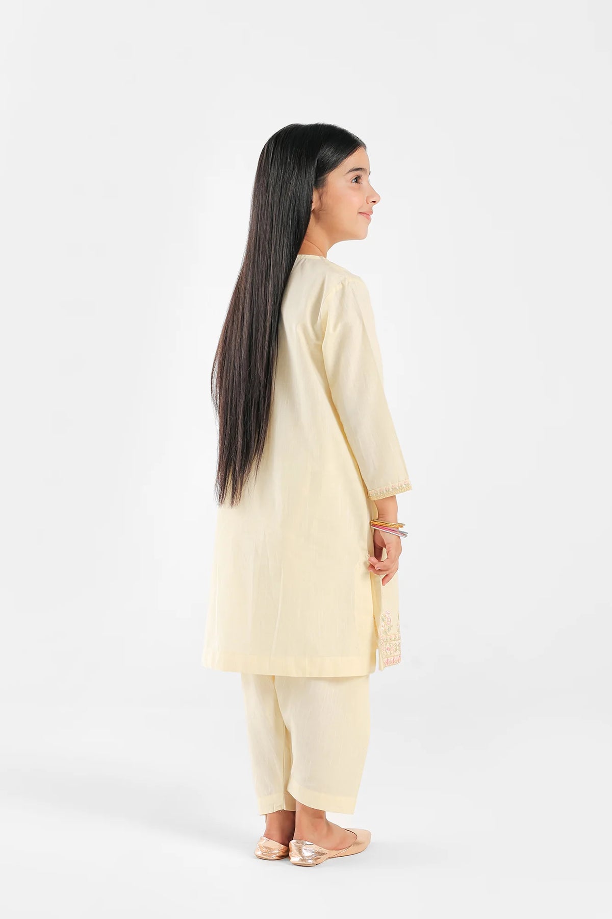 Side view of the pale yellow embroidered suit by Ethnic, a stylish pick for premium Pakistani suits for kids in Canada.