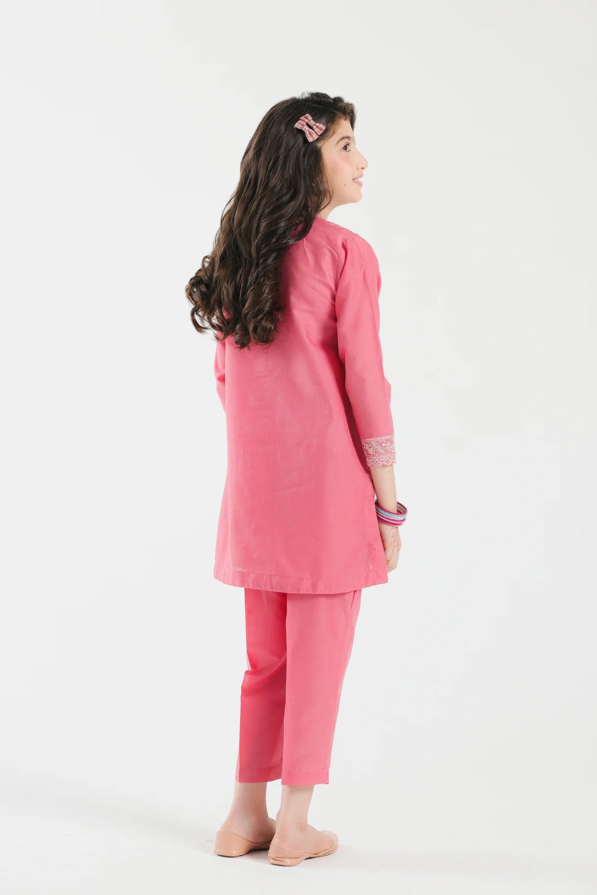 rear view of Ethnic flamingo pink embroidered Pakistani suit, crafted with high-quality lawn fabric – an elegant choice for kids' formal fashion.