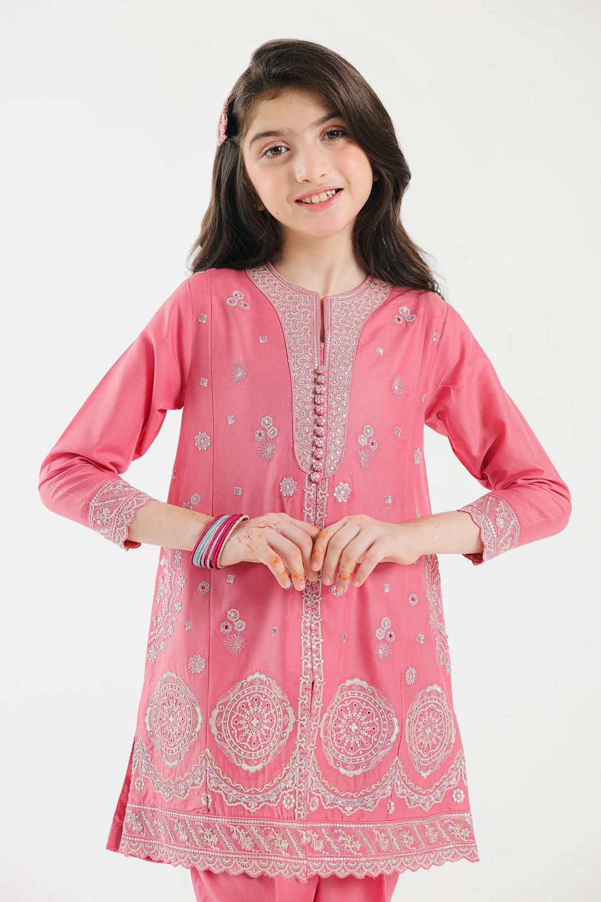 front profile of Ethnic’s flamingo pink embroidered suit, featuring delicate scalloped edges – a premium choice for Pakistani suits for kids.
