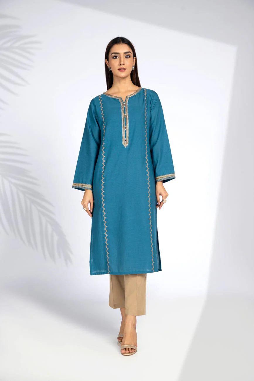 A woman wearing a medium-sized teal blue cotton karandi shirt from Chinyere, a stylish option for Pakistani suits online in Canada.