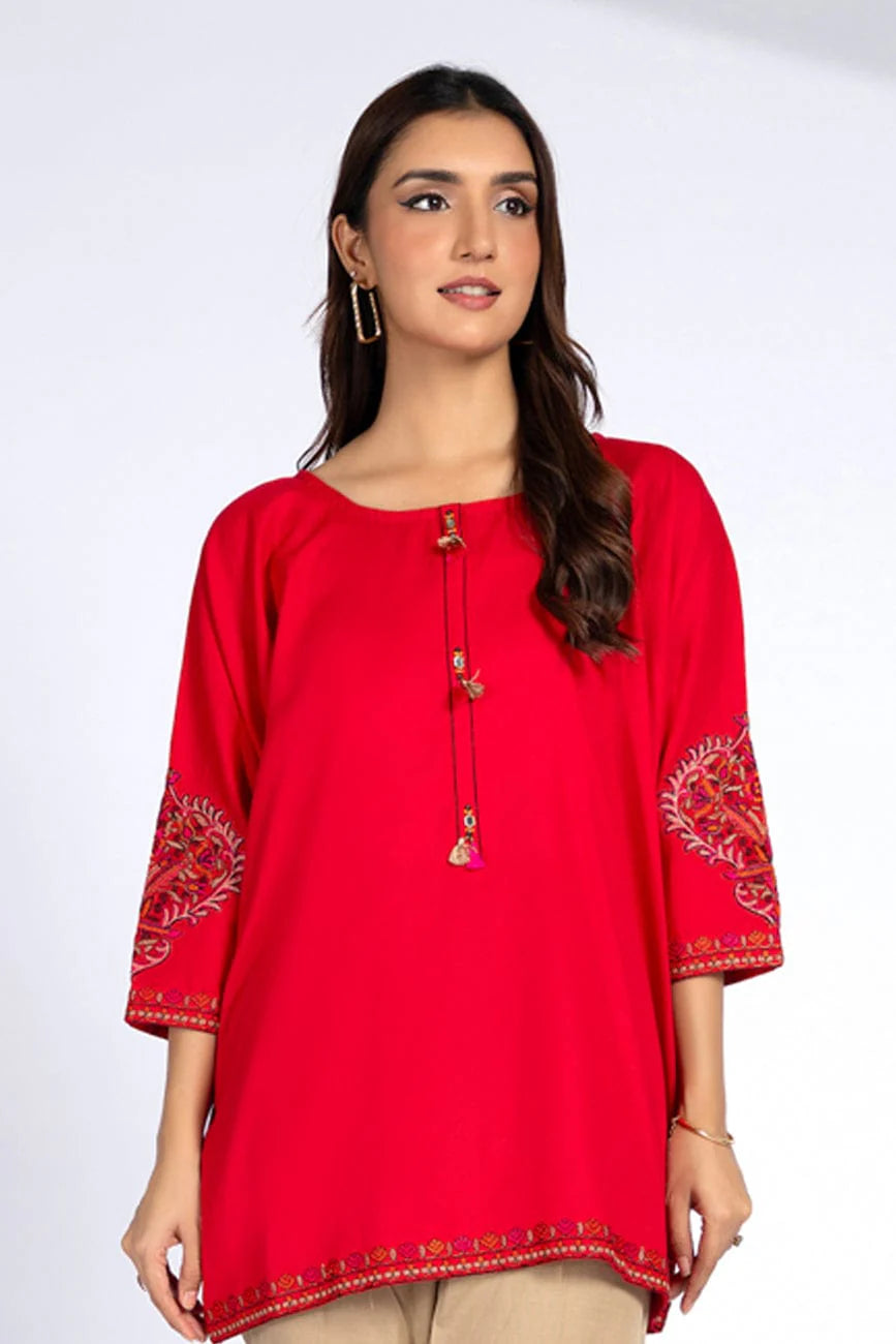 A woman wearing a radiant red Chinyere lawn karandi 1PC shirt – perfect for those looking for Pakistani suits online in Canada.