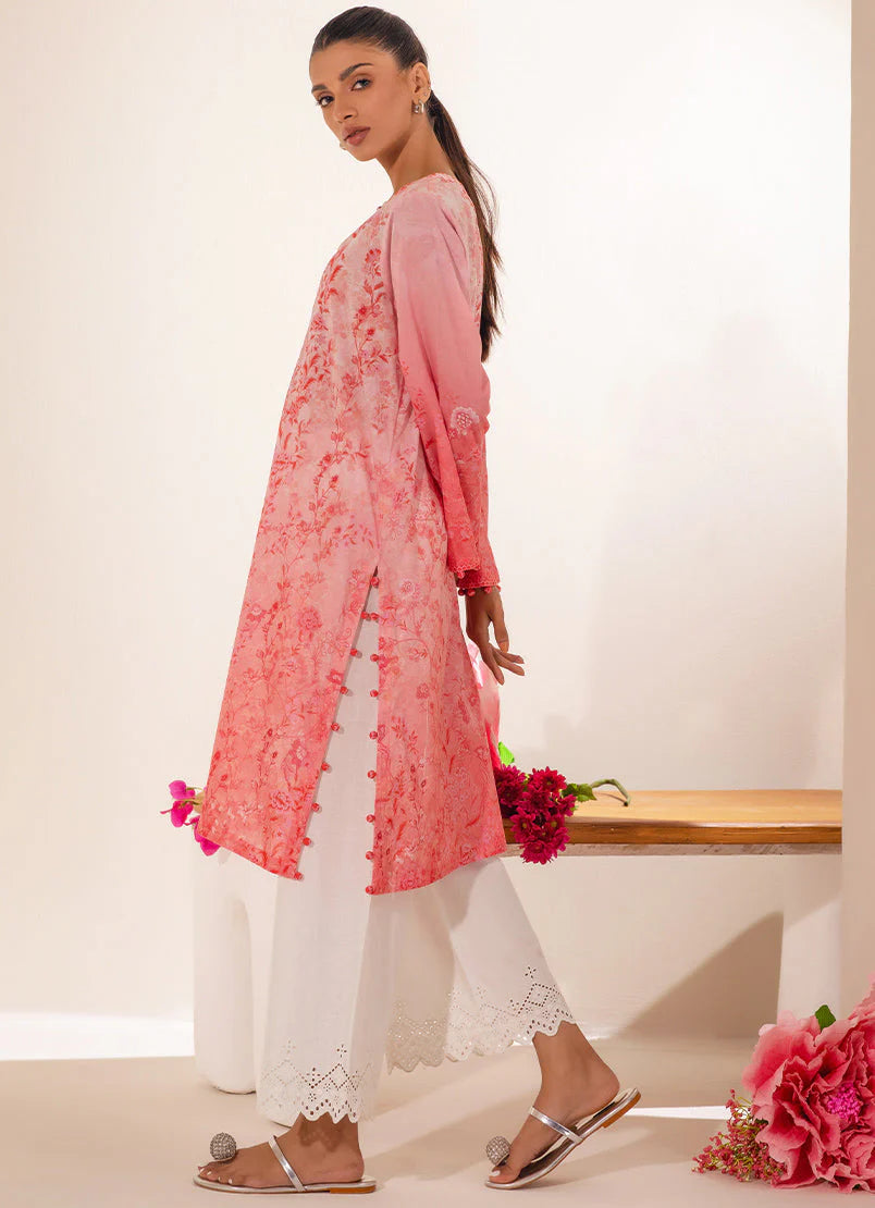 A woman wearing a medium-size peach floral printed cotton kurta, showcasing traditional Pakistani clothes for women in Canada.
