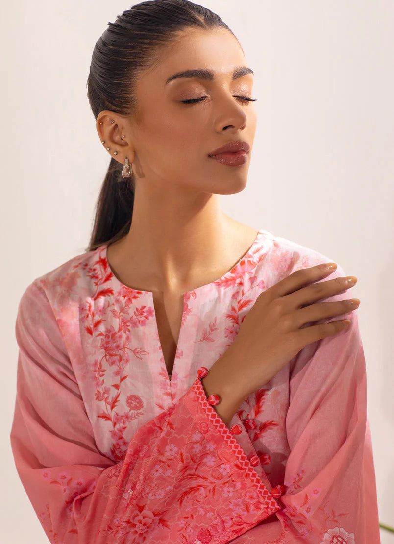 Detailed embroidery and beadwork on the V-neckline of this peach cotton kurta, perfect for traditional Pakistani clothes.