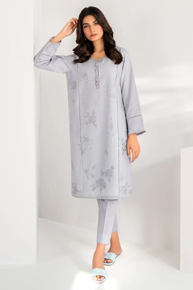 Detailed close-up of Jazmin’s embroidery on a grey synthetic organza fabric, showcasing fine craftsmanship in Pakistani suits online Canada.