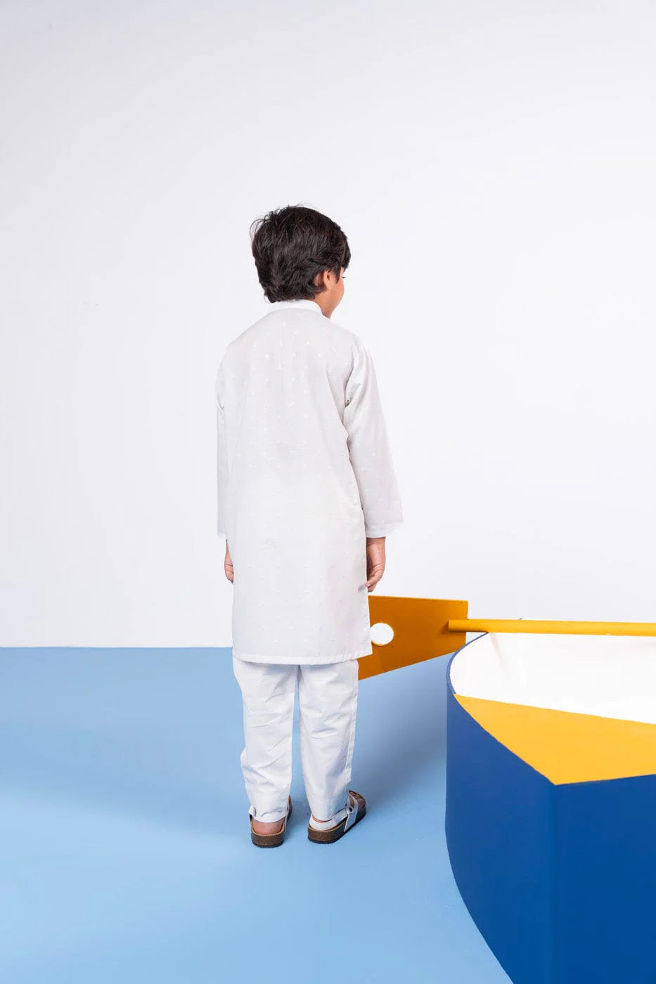Back view of Alkaram’s white dyed yarn shirt – premium Pakistani suits online in Canada for kids.
