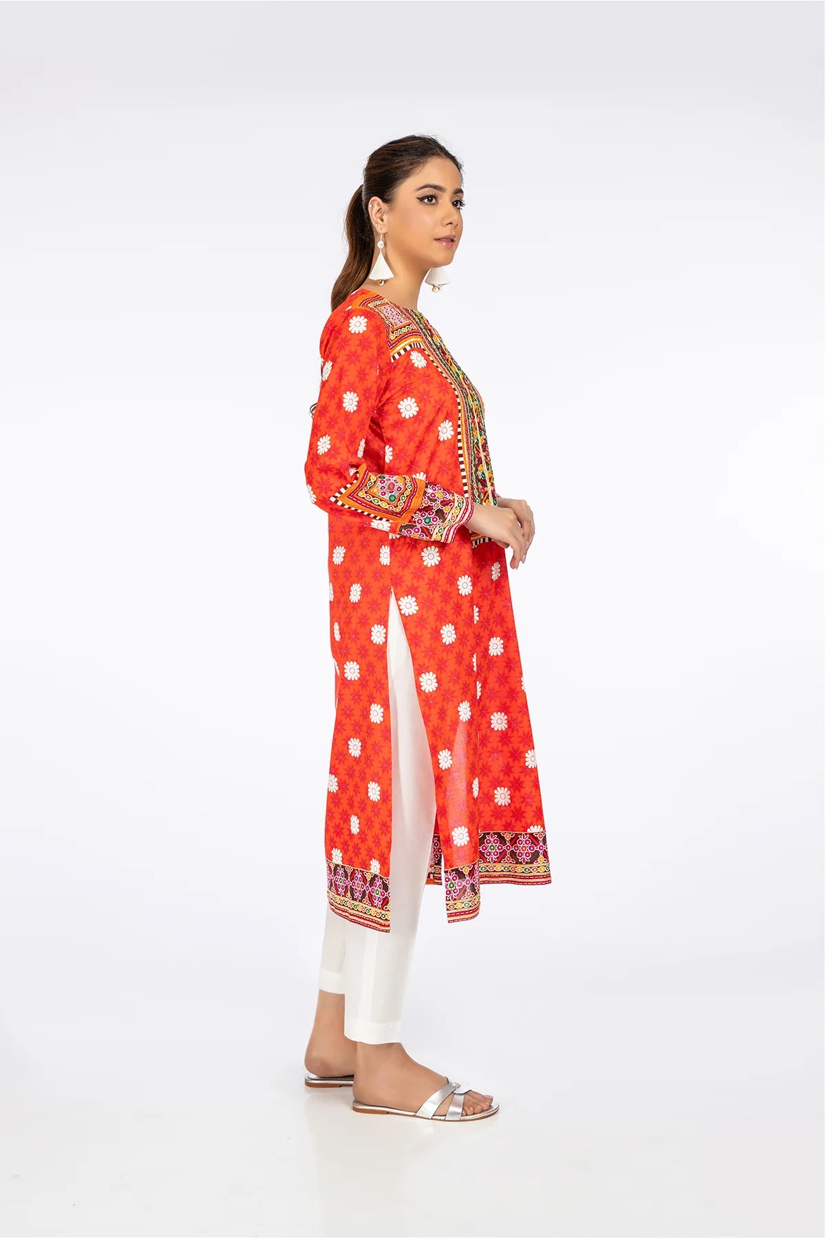 left Side view of a women wearing Kayseria’s Portland orange cotton lawn shirt, showcasing intricate prints and high-quality craftsmanship.