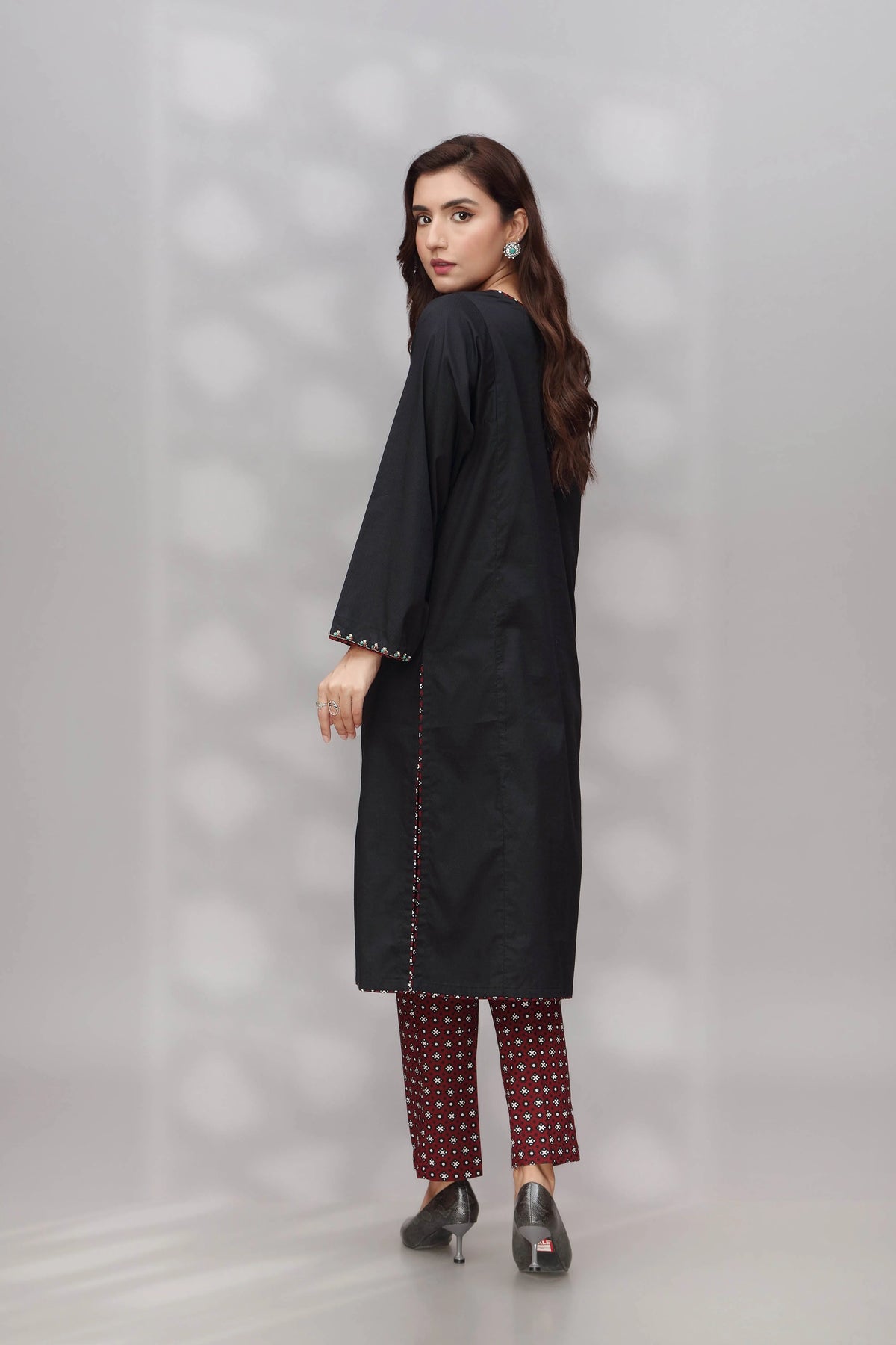 Rear view of the Chinyere black dobbi suit, displaying its sophisticated silhouette – an ideal addition to Pakistani suits Canada.