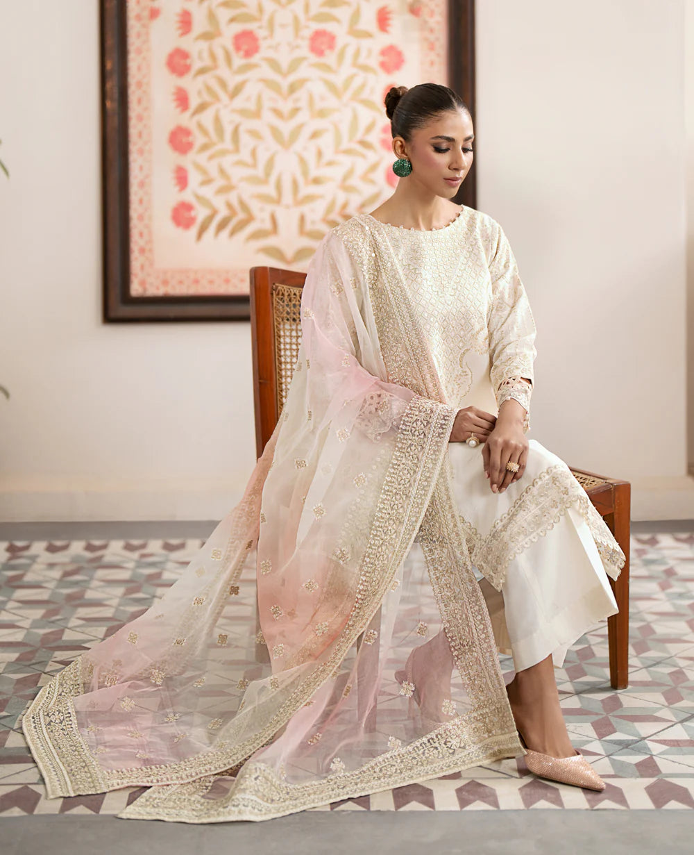 Off-white Pakistani suit from Xenia – embroidered silk outfit, perfect for formal wear in Canada.