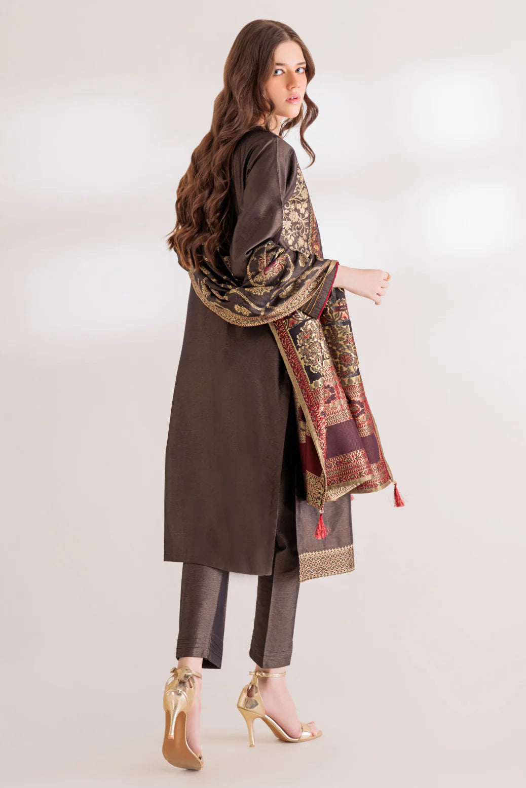 women showing Back view of Bonanza Satrangi’s black Maisuri embroidered suit, perfect for cultural wear in Canada.