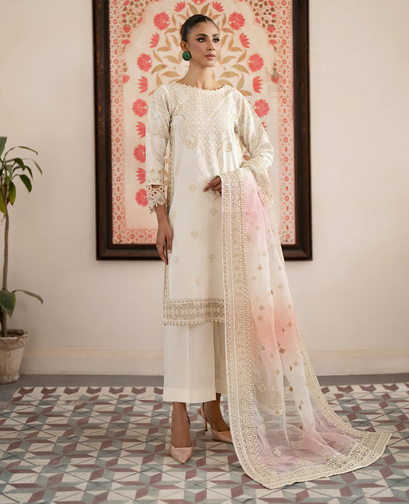 women standing looking at left wearing Pakistani suits in Canada – Xenia’s off-white embroidered 3-piece silk suit, perfect for formal occasions.