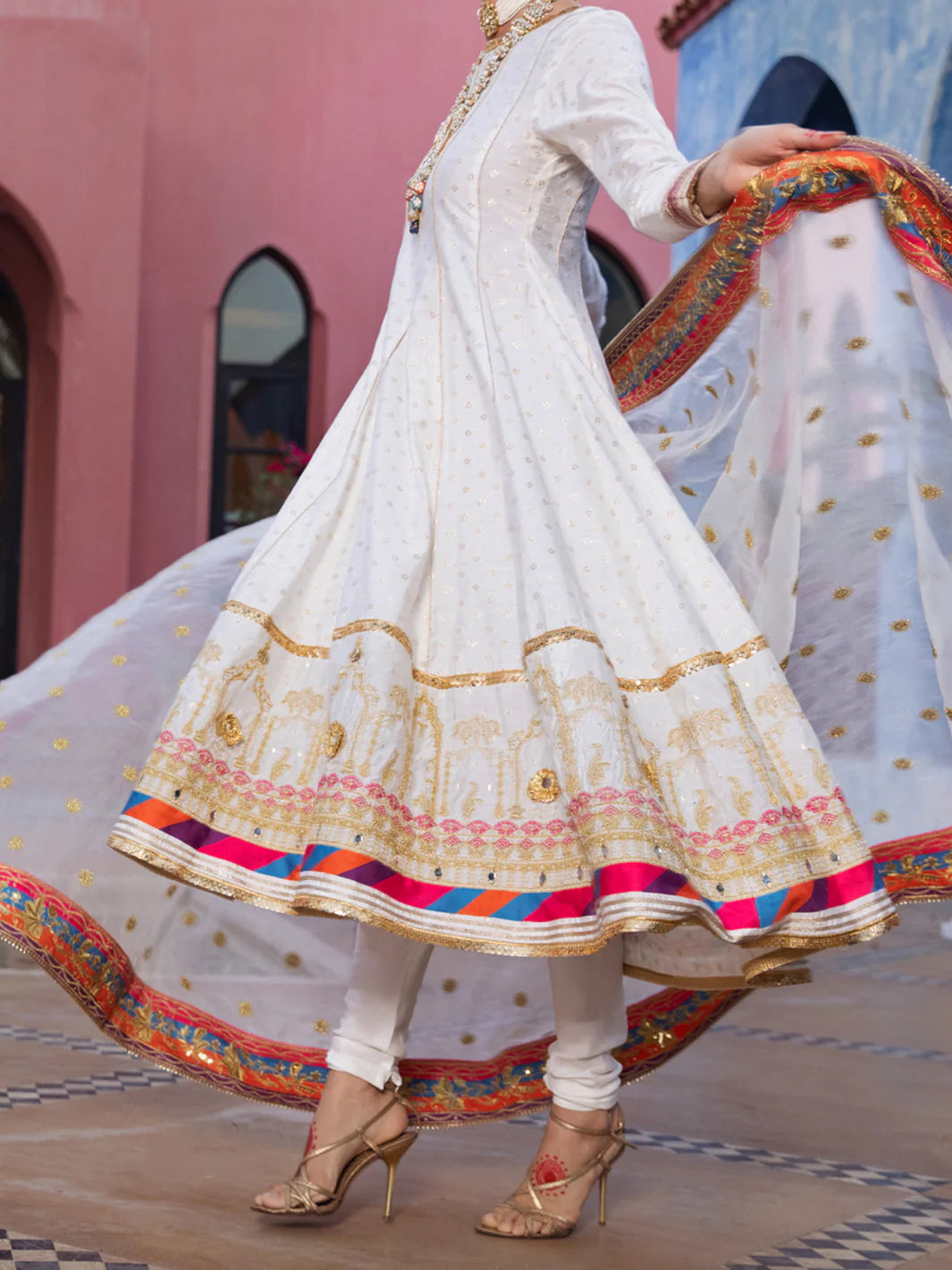 Side profile of Almirah’s off-white embroidered suit, showcasing delicate lace detailing – a must-have Punjabi suit for women in Canada.