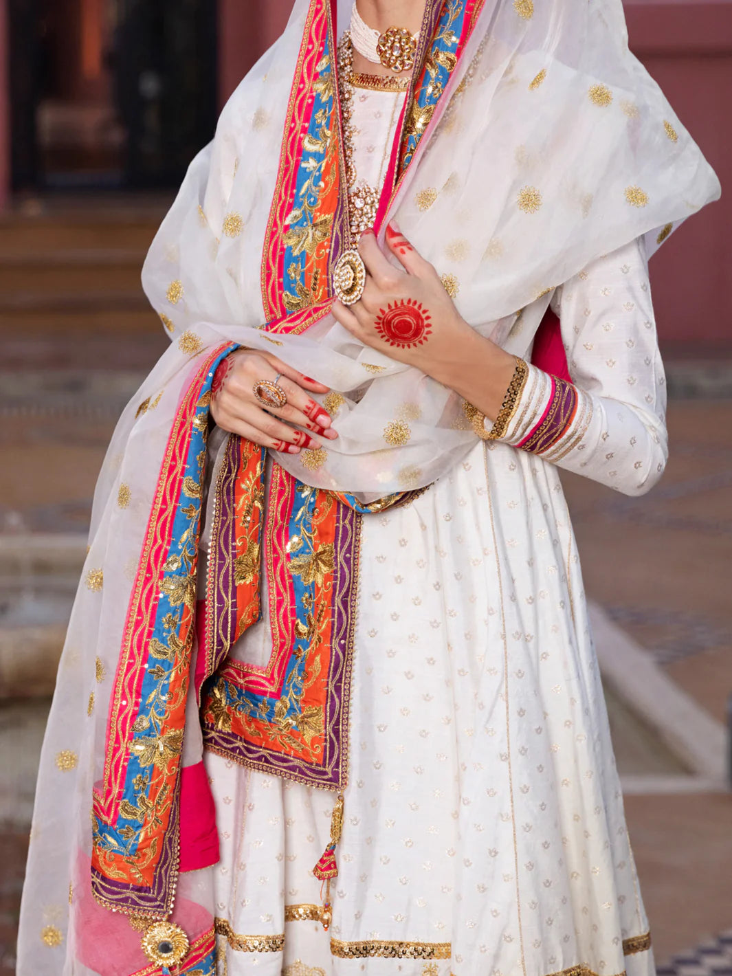 women showing duppatta closeup of Stylish Pakistani suits in Canada – Almirah’s off-white chiffon suit features exquisite embroidery and a timeless design