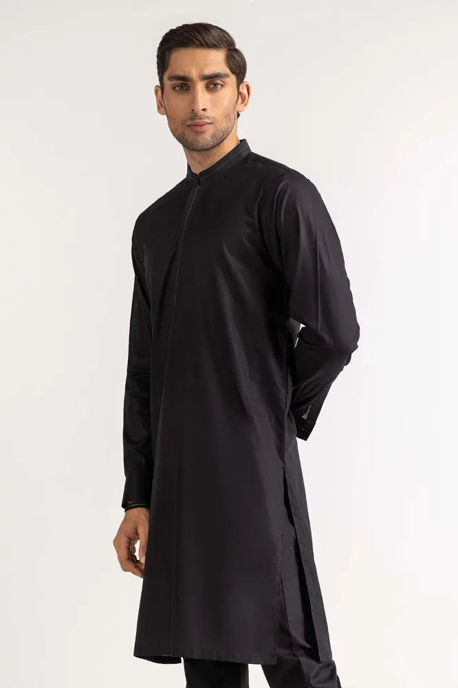 Side profile of GulAhmed’s black suit, showcasing fine craftsmanship – a premium Pakistani suit for men in Canada.