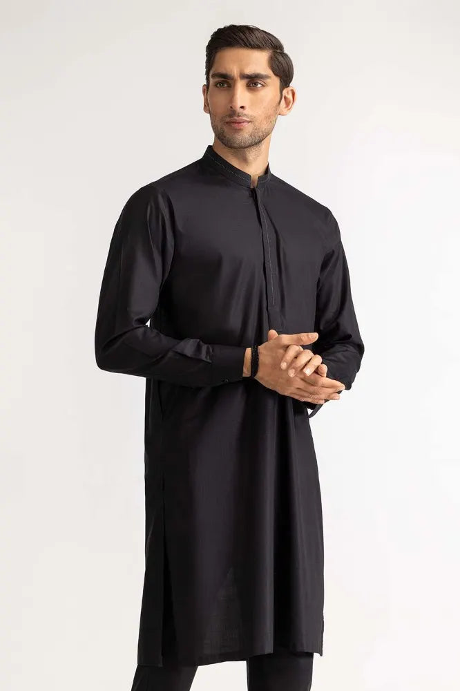 GulAhmed’s black suit is an ideal Punjabi suit choice for men looking for traditional elegance.