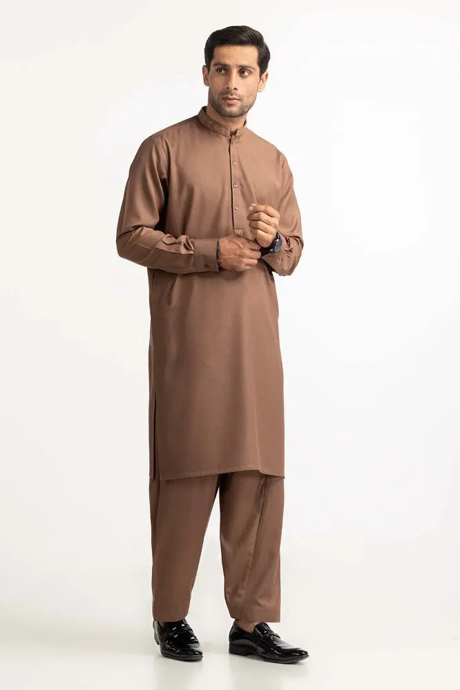 Pakistani suits in Canada – GulAhmed’s brown embroidered suit features fine craftsmanship and a timeless design for men’s fashion.