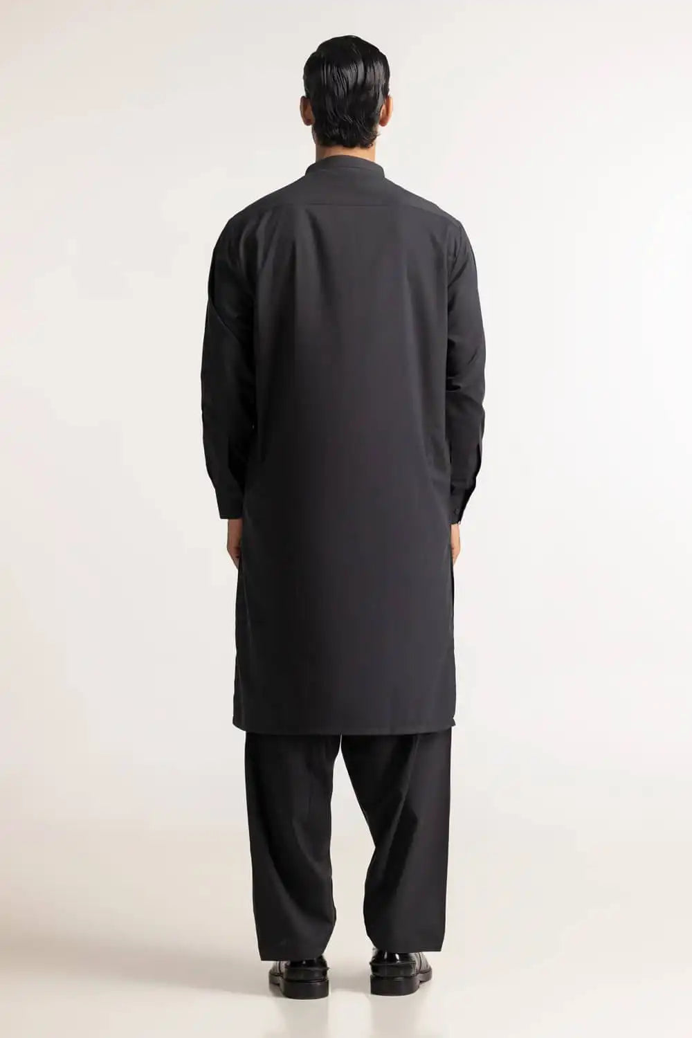 Rear view of the charcoal blended suit by GulAhmed – a sophisticated addition to men’s Pakistani suits online in Canada.
