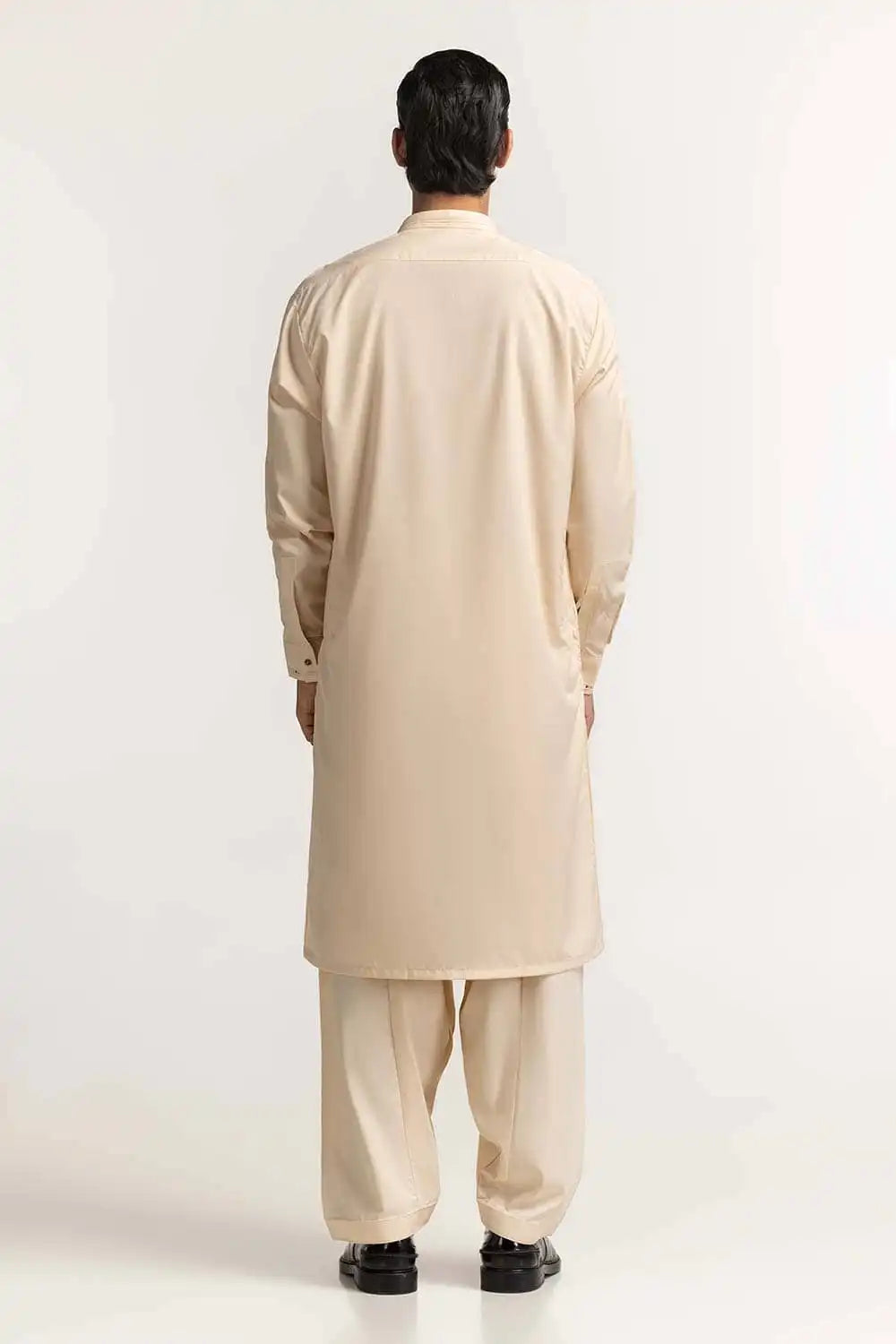 Rear view of the cream blended suit by GulAhmed, designed for a polished look in Pakistani suits online in Canada for men.