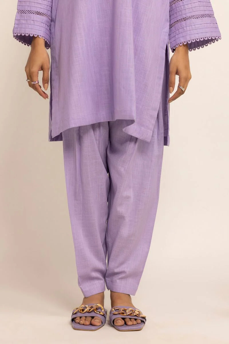 A woman wearing a lilac Khaadi cotton winter shalwar – a top choice for traditional Pakistani clothes in Canada.