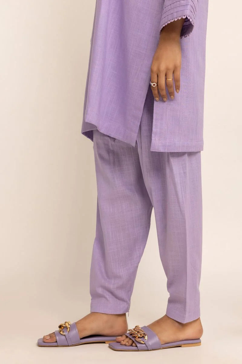 side view of  Elegant lilac shalwar from Khaadi, crafted from 100% cotton – perfect for Punjabi suits lovers.