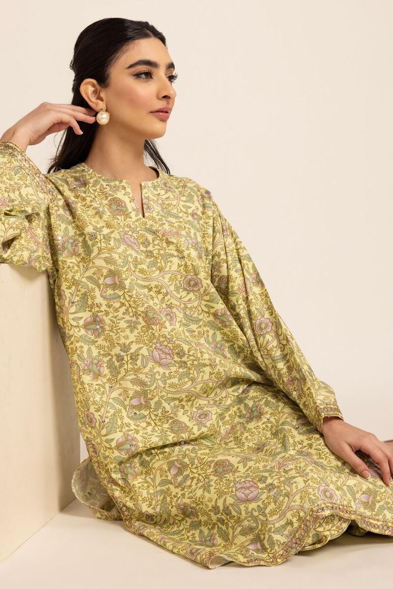 WOMEN WEARING Khaadi green embroidered kurta – a stylish choice for Pakistani suits online in Canada, made from a premium viscose-cotton blend.