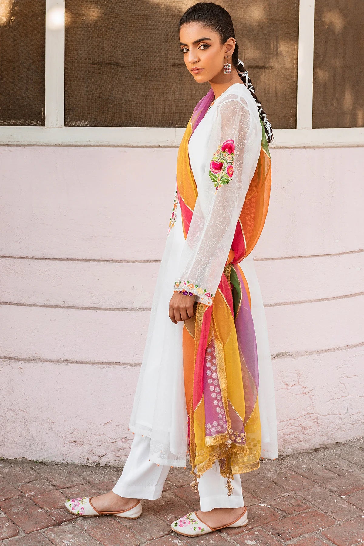 Side profile of Keyseria’s white embroidered synthetic organza suit – a refined option for Pakistani suits Canada, crafted for semi-formal wear.