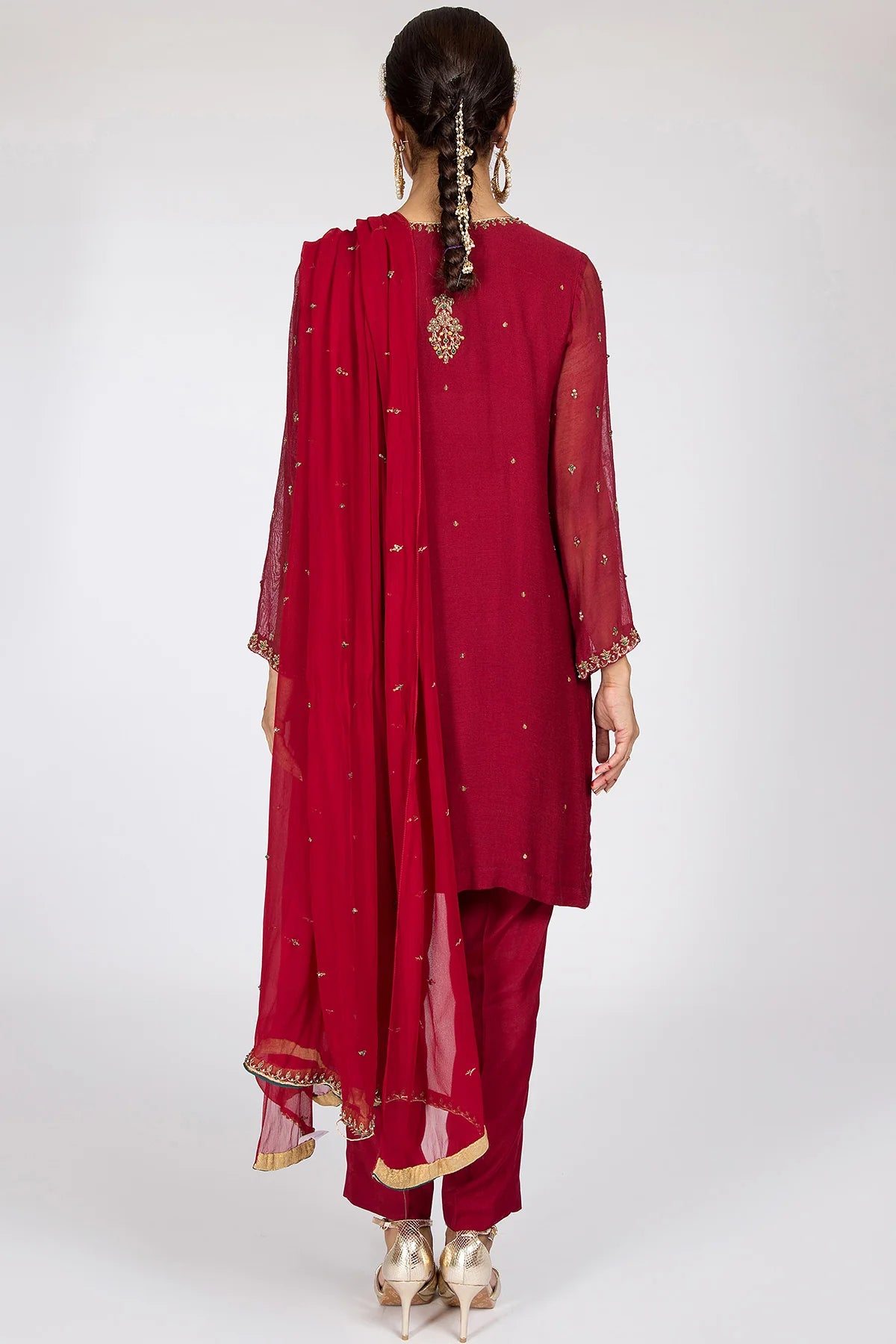 Back design of the Kayseria maroon silk net suit, displaying fine craftsmanship and premium finishing, ideal for semi-formal occasions.