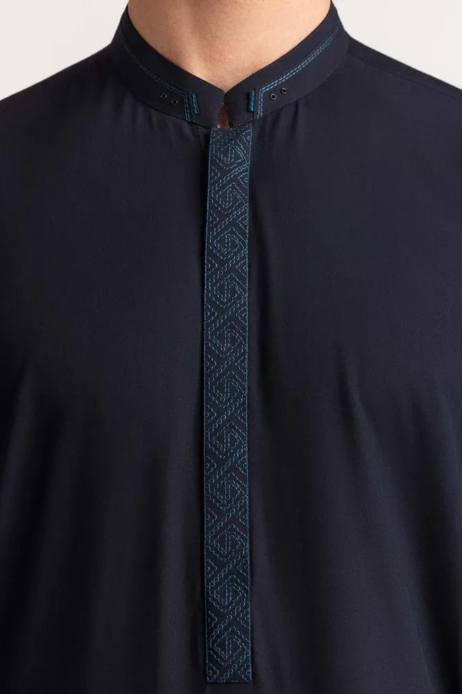 closeup of Detailed embroidery of GulAhmed’s navy blue suit, highlighting its premium craftsmanship – a must-have Pakistani suit for men in Canada.