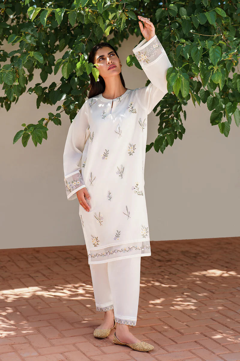 Full-length view of off white lawn outfit featuring delicate floral embroidery, flowing silhouette, and matching cotton shalwar for casual elegance
