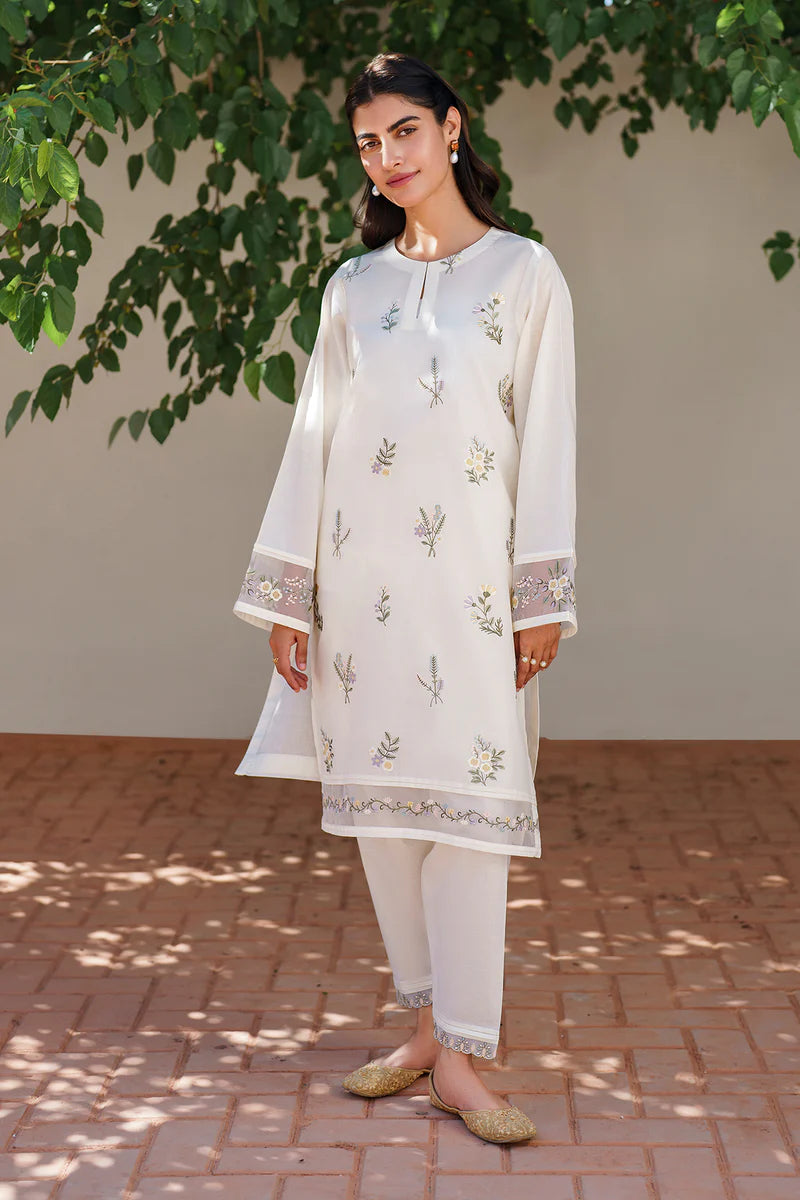 Elegant off white embroidered lawn suit with delicate floral motifs, featuring traditional Pakistani formal wear styling and comfortable cotton shalwar