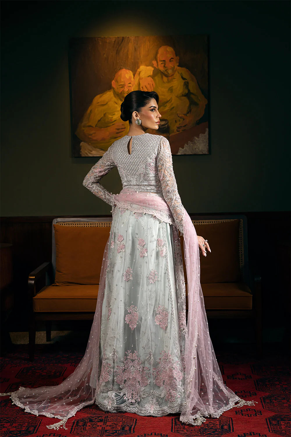 Back view of Saira Rizwan bridal dress showcasing embroidered blouse, flowing dupatta, and traditional Pakistani bridal suit craftsmanship