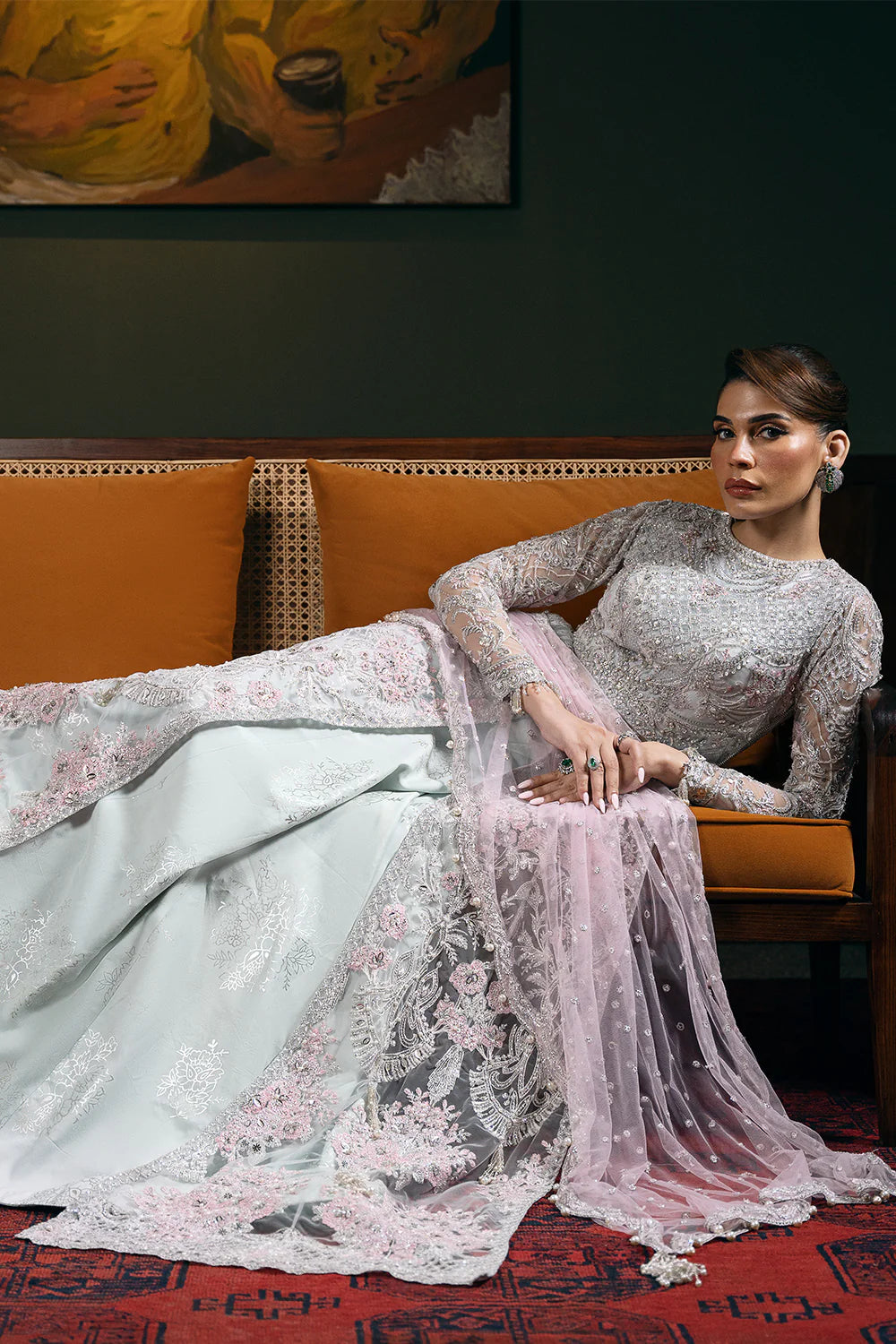 Close-up detail of Saira Rizwan bridal dress fabric showing intricate embroidery, sequins, and premium net silk craftsmanship with traditional Pakistani motifs