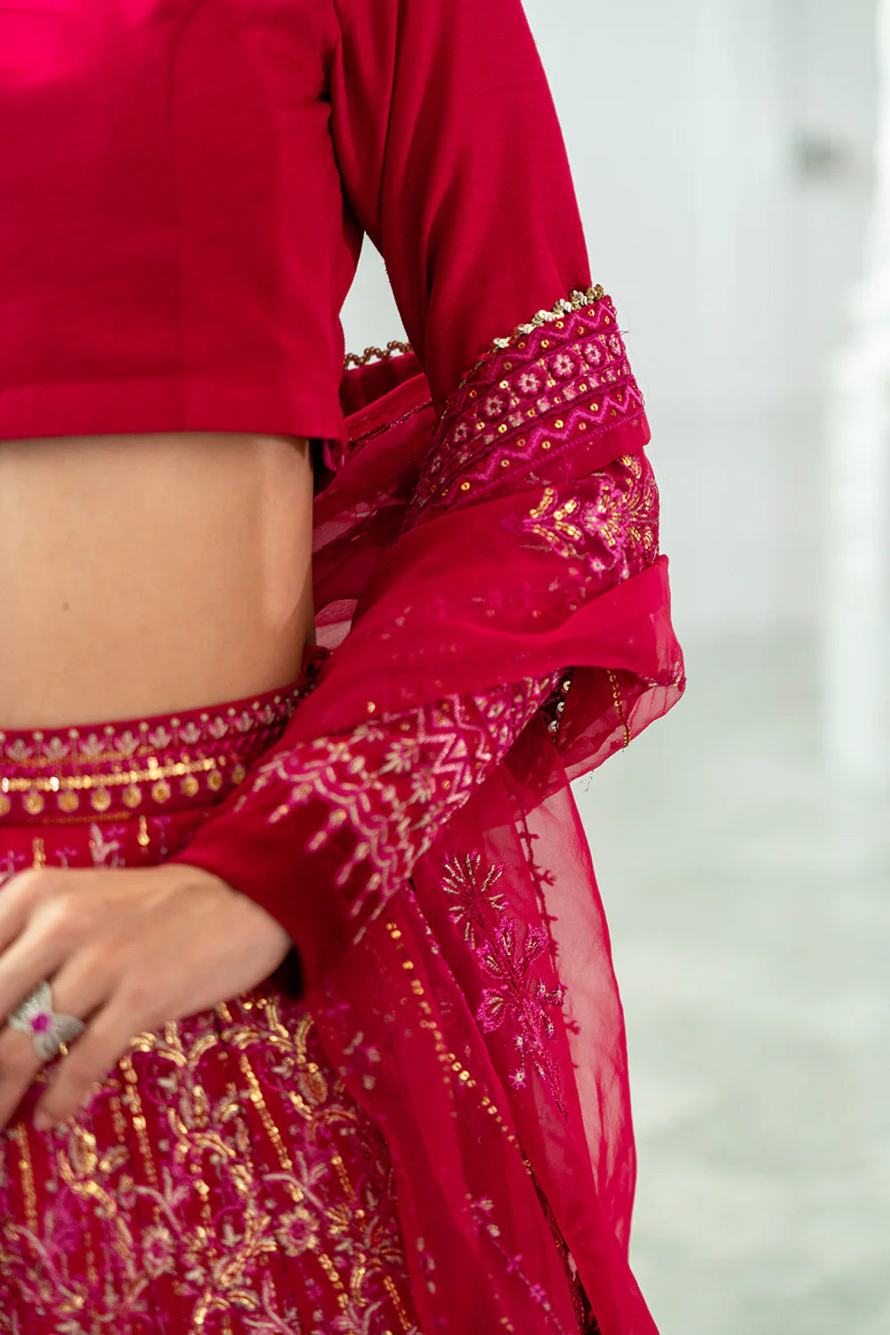 Saira Rizwan bridal lehenga detail shot - Korean silk choli sleeve and dupatta embellishment close-up - Pakistani designer wear Canada