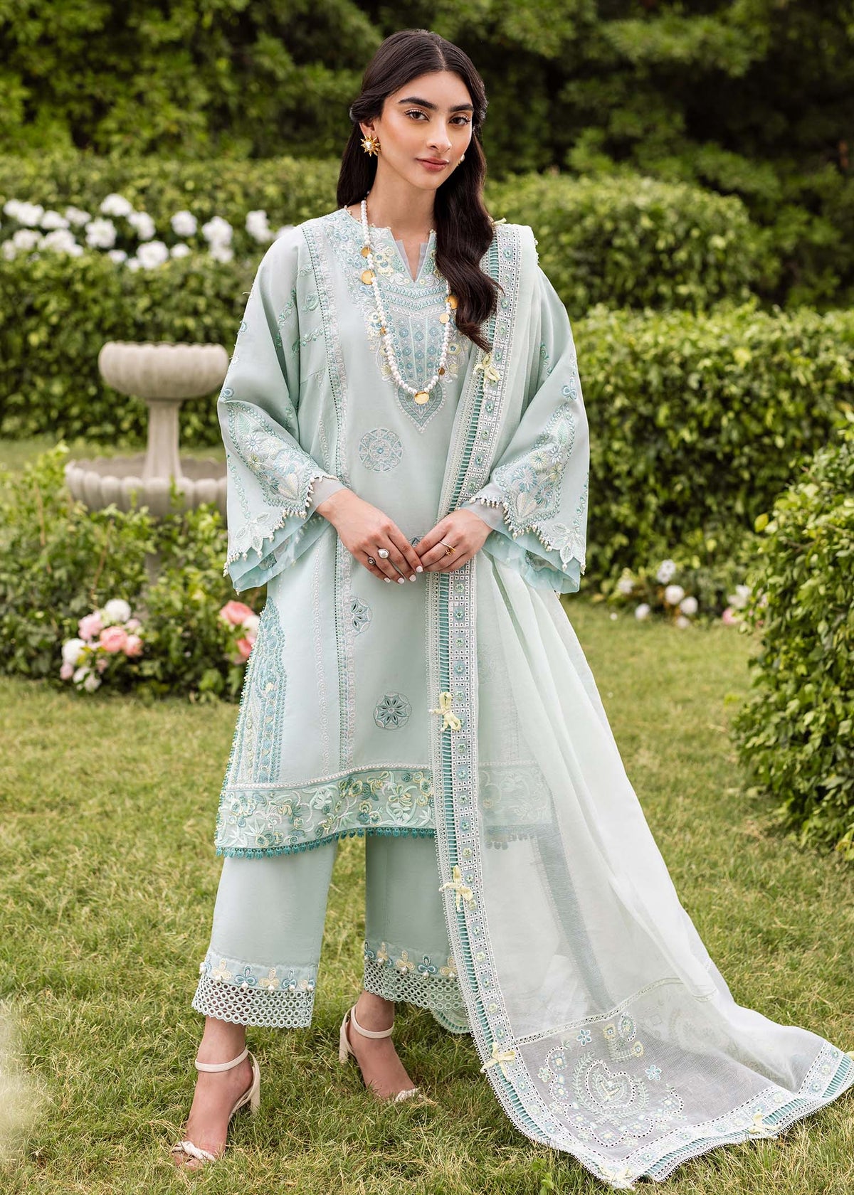 Traditional Pakistani clothing - Aqua Zaphira by Brand Sadaf Fawad Khan with embroidered lawn and khaddi net dupatta.