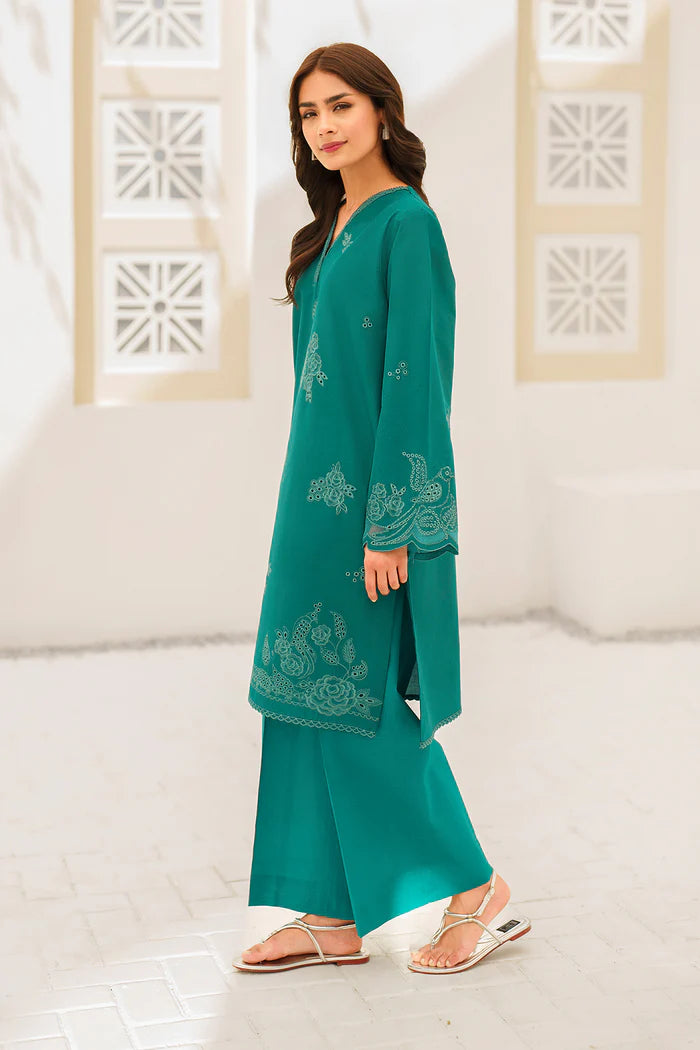 Elegant teal embroidered Pakistani suit with intricate paisley and floral motifs, featuring detailed sleeve embellishments and traditional neckline
