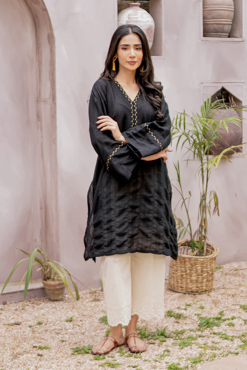 front view of the black embroidered lawn shirt by Armaas, a timeless addition to Pakistani suits online in Canada for women.