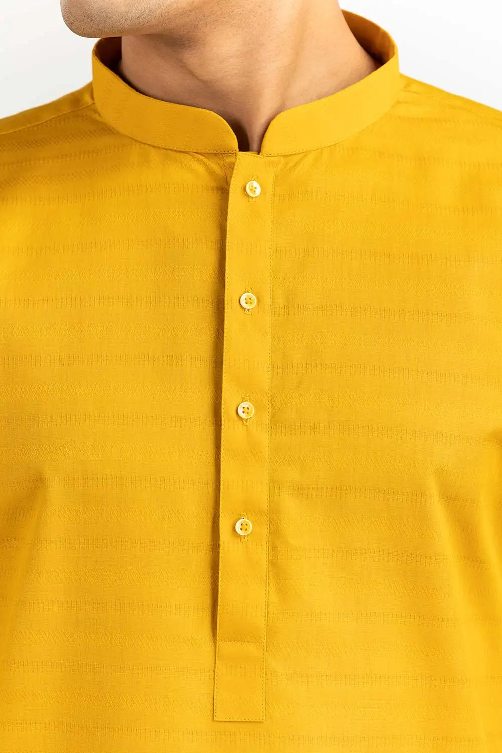 close-up of Premium cotton-blended fabric close-up of the Gulahmed yellow kurta. Soft, breathable, and perfect for all-day wear.