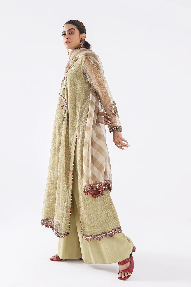 Elegant side view of Charizma’s embroidered suit, showcasing intricate adda work – buy Pakistani suits in Canada today.