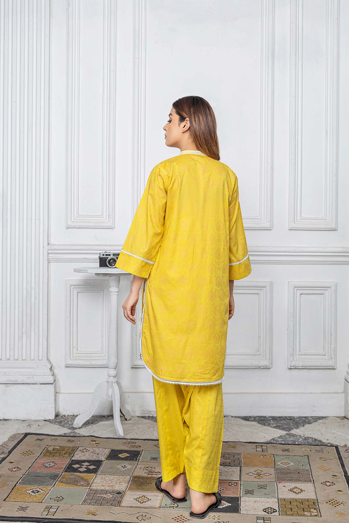 Rear view of the yellow tabel print lawn shirt by Charizma, featuring fine craftsmanship and premium raw silk fabric.