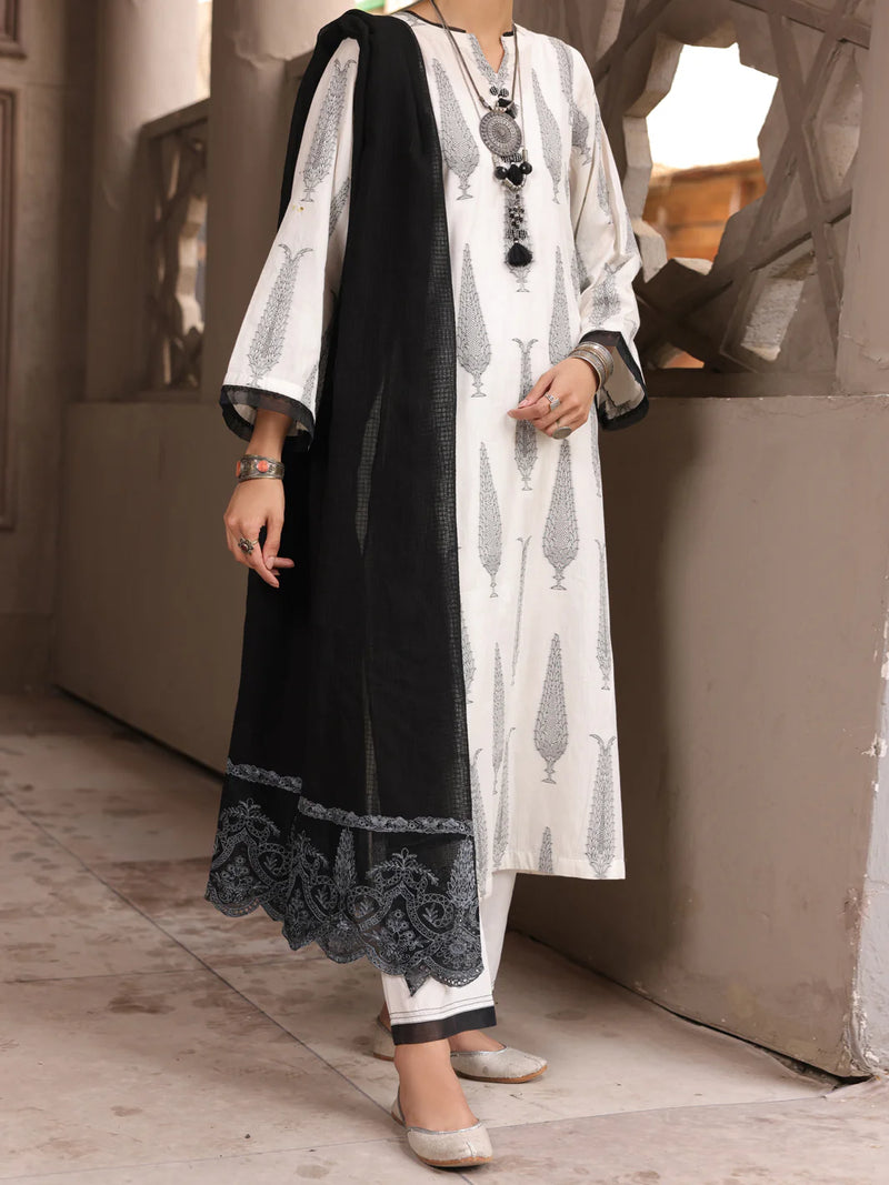 A woman wearing a black & white jacquard 3PC stitched suit by Almirah, perfect for Pakistani suits online in Canada.