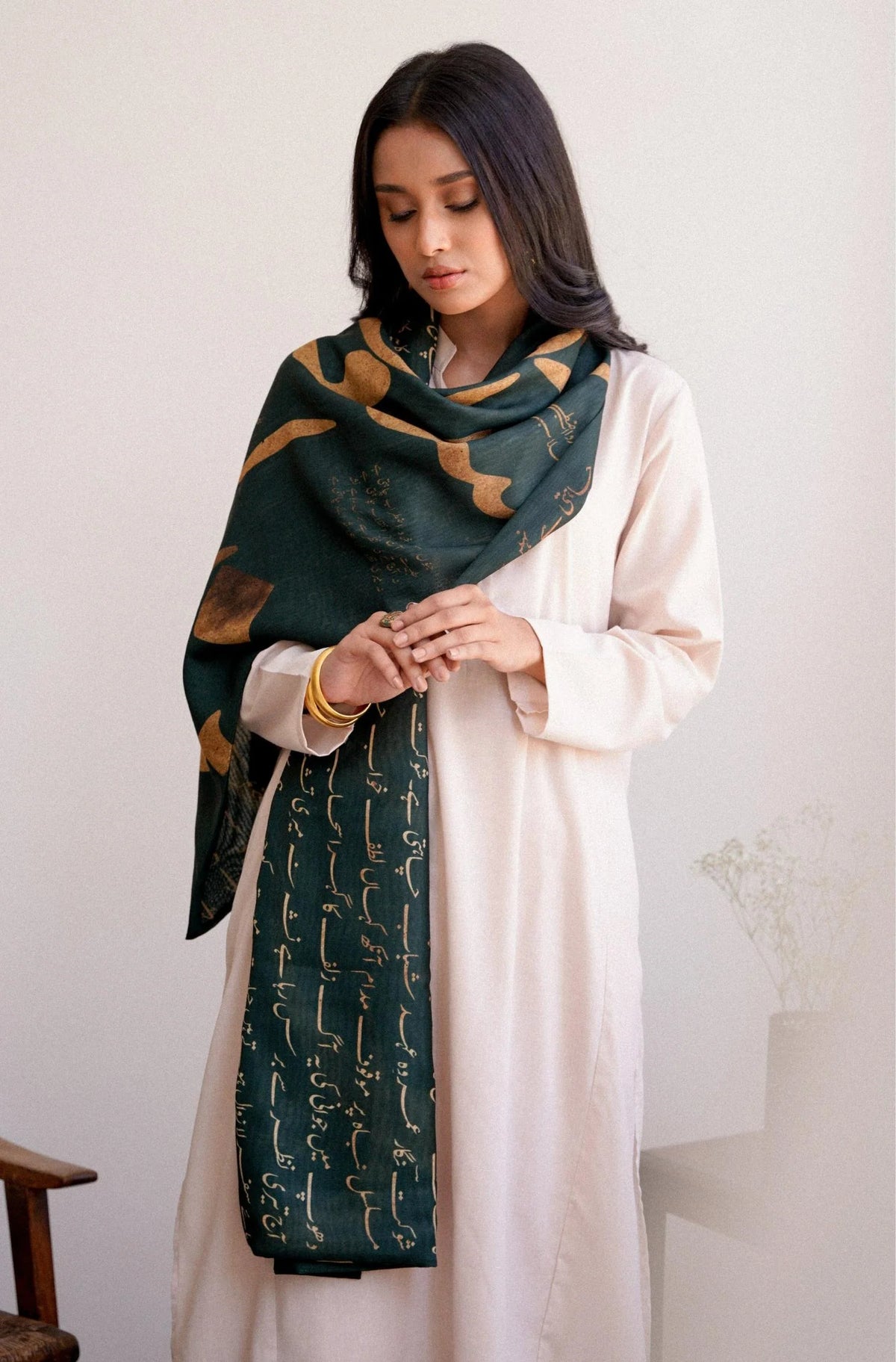 Model wearing Manto Junoon emerald green textured polyester stole - elegant Pakistani scarf styling
