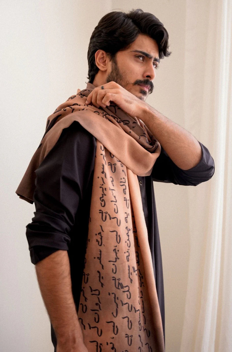 Stylish side pose showcasing Manto Karvaan light brown textured polyester stole for men - premium Pakistani accessory