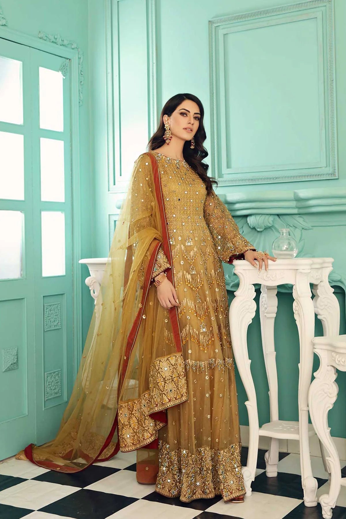 Charizma’s golden organza embroidered suit – a refined choice for Punjabi suits in Canada, featuring intricate adda work.