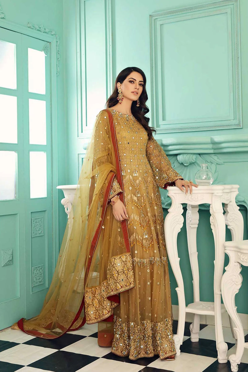 Charizma’s golden organza embroidered suit – a refined choice for Punjabi suits in Canada, featuring intricate adda work.
