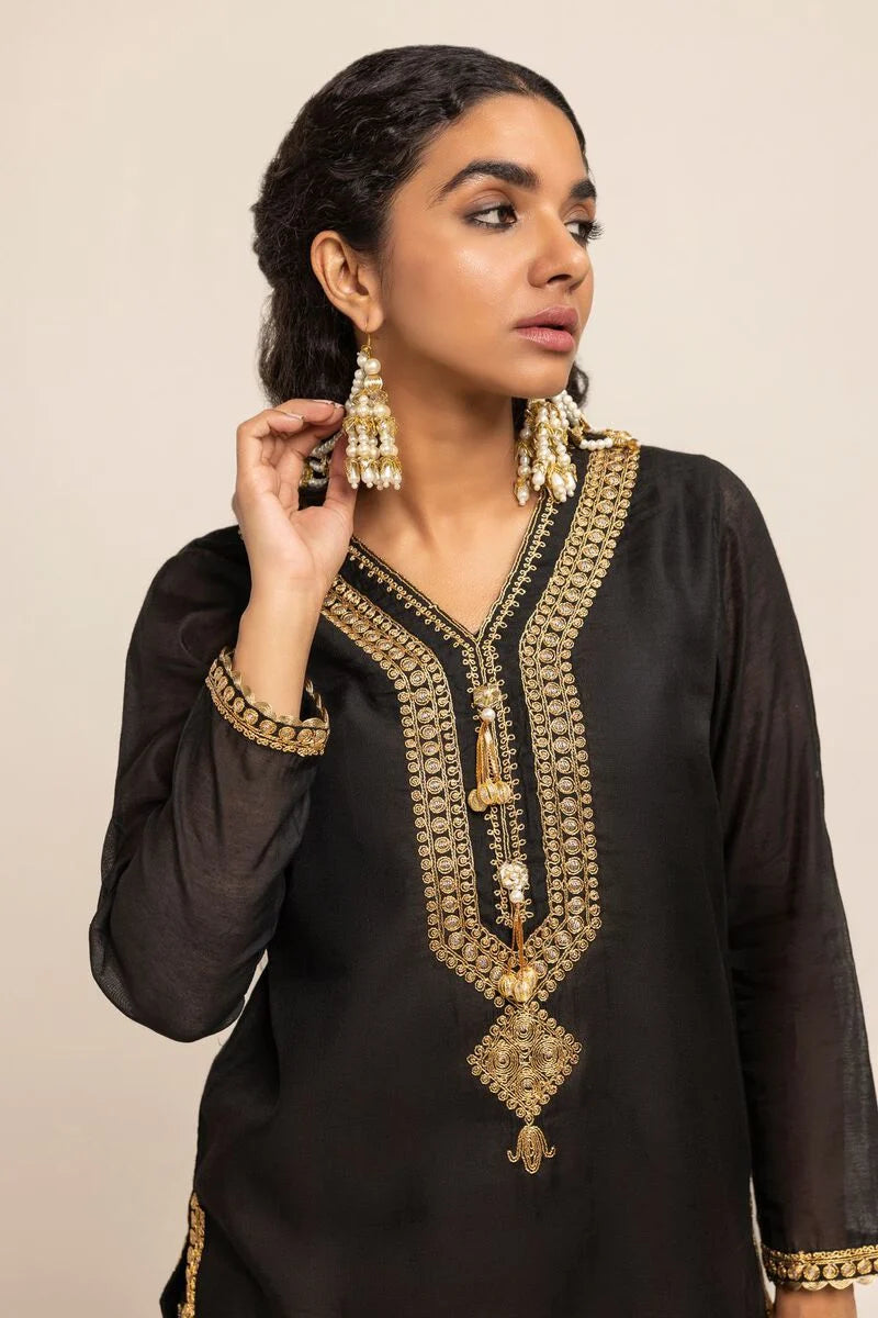 Stylish black Khaadi kurta for women, a trendy Pakistani suit in Canada, made from a soft cotton blend.