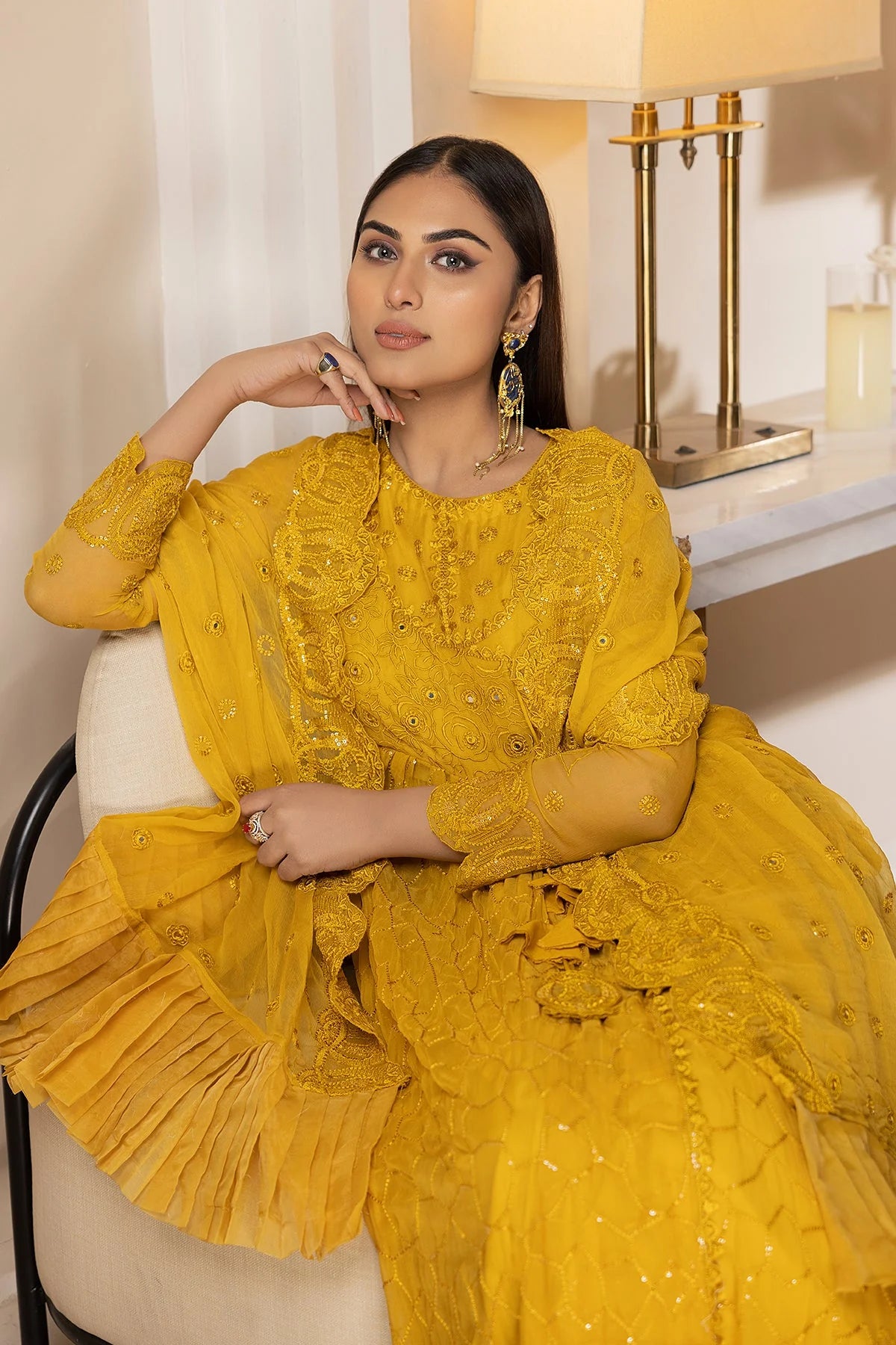 Close-up of intricate sequence and mirror embroidery on the yellow chiffon maxi, a premium Pakistani suit in Canada.